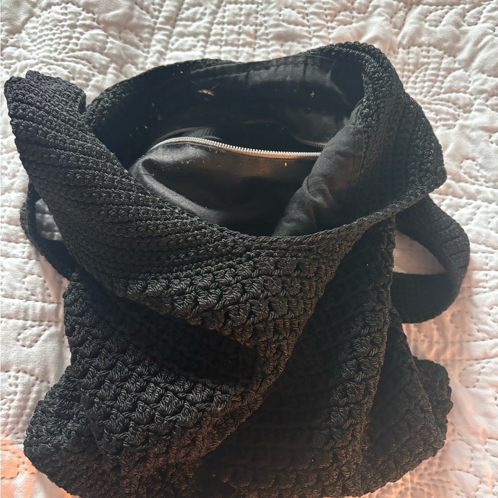 Nice, black knitted bag with strap.